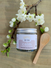 Load image into Gallery viewer, BEAM natural body care calm clay Face mask for sensitive skin on a board with flowers
